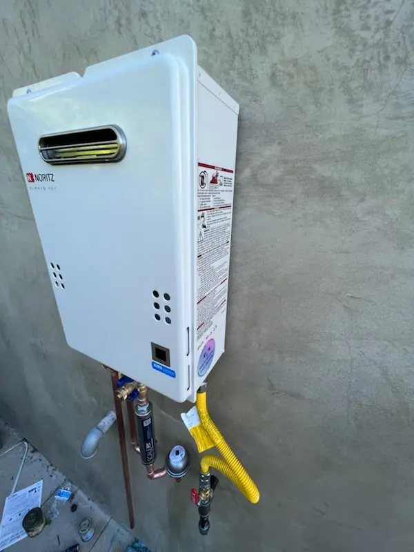 Tankless water heater installation for Huntington by the Campus homes